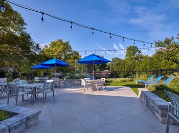 Hill House courtyard with seating, BBQ grills and a gazebo